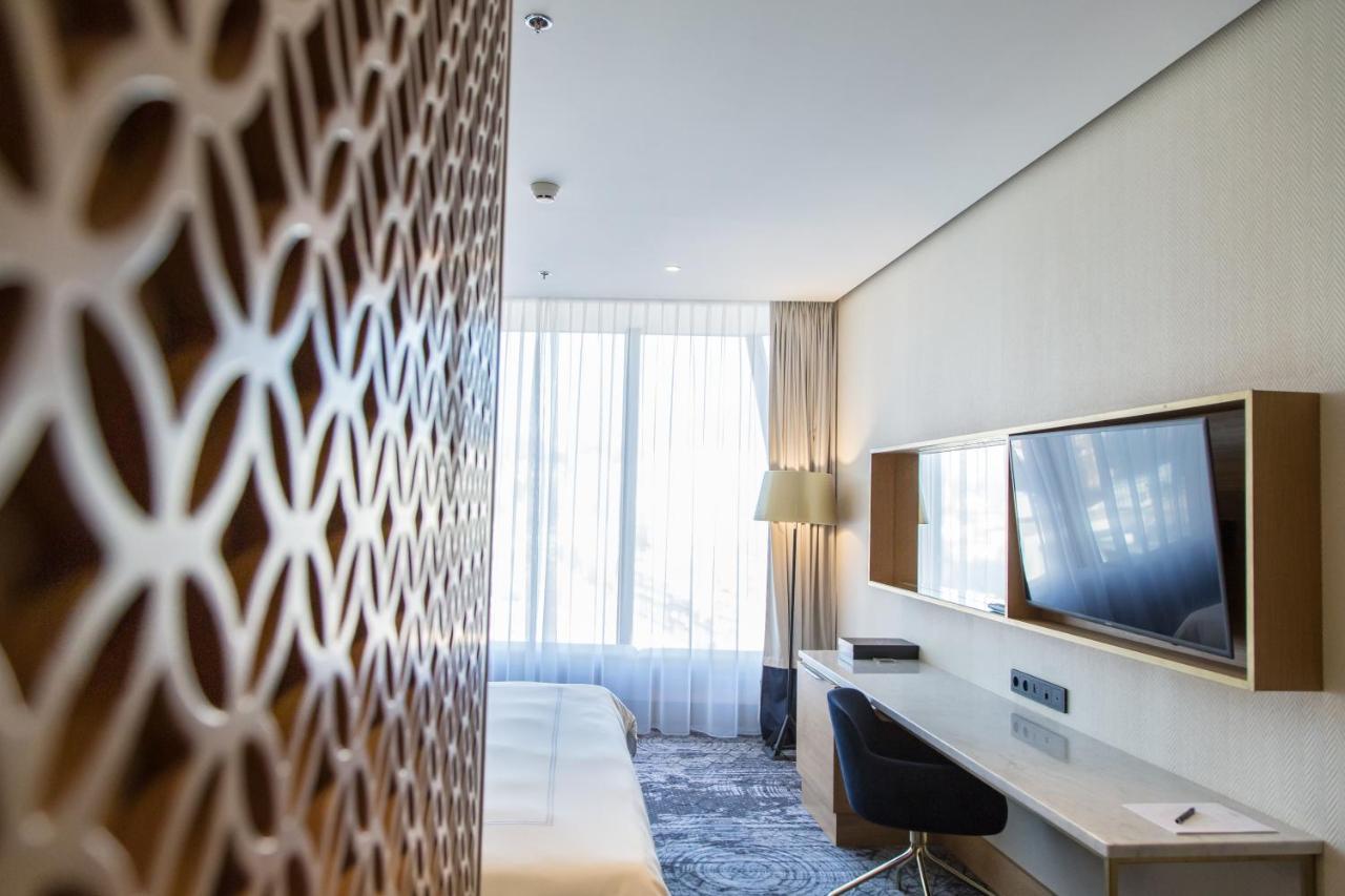 Swissotel SJJ Esterno foto A room at the hotel